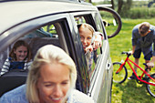 Portrait girl with family inside car