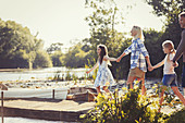 Family holding hands and walking