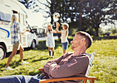 Serene father resting in lounge chair