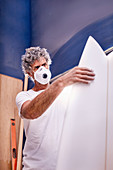 Focused man wearing protective mask