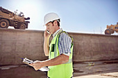 Construction worker foreman talking on cell phone