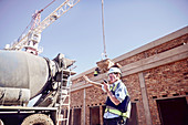 Construction worker foreman using walkie-talkie