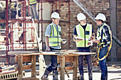 Construction workers and foreman talking