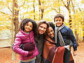 Portrait young family in autumn park