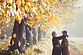 Affectionate couple in autumn park