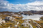 Clouds over rocks and water, Hebrides, Scotland
