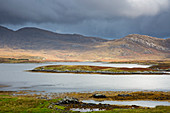 Clouds over hills and lake, Hebrides, Scotland