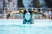 Male swimmer athlete butterfly stroke swimming