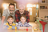 Portrait smiling male gay parents and children