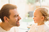 Father smiling at baby son