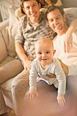 Portrait baby son with male gay parents