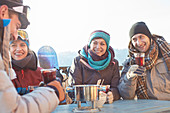 Snowboarder friends drinking cocktails