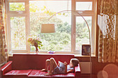 Boy reading, using digital tablet