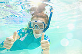 Portrait confident girl snorkelling