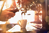 Close up barista using espresso machine