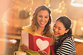 Lesbian couple with Valentine's Day card