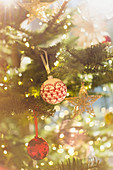 Red, white and gold ornaments on Christmas tree