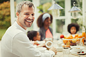 Father with family at breakfast table