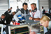 Manager and formula one driver talking