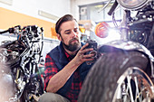 Motorcycle mechanic doing diagnostic test