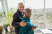 Portrait senior couple hugging and drinking coffee