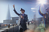 Businessman using VR simulator glasses, London, UK