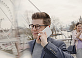 Man talking on cell phone, London, UK
