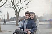 Hugging couple in urban park, London, UK
