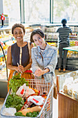 Portrait lesbian couple in market