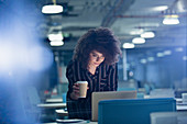 Businesswoman working late at laptop