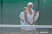 Focused tennis player ready with tennis racket