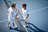 Young tennis players handshaking