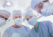 Portrait surgeons wearing surgical masks