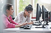 Girl students studying at computers