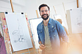 Portrait male artist with beard sketching