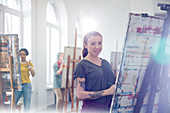Portrait female painter with tattoos painting