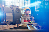Portrait tough male worker working in factory