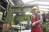 Portrait male worker working in steel factory
