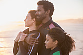 Serene affectionate family looking away