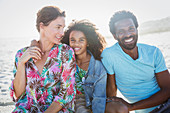 Portrait multi-ethnic family on sunny summer beach