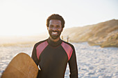 Portrait male surfer with surfboard