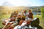 Friends hanging out, enjoying picnic