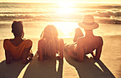 Carefree young friends relaxing on beach