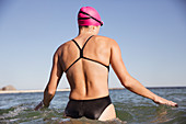 Female swimmer wading