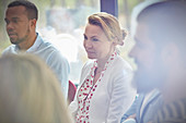 Woman listening in group therapy session