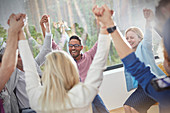 People holding hands in circle in group therapy