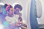 Affectionate couple on airplane