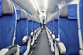 Empty blue seats in a row in airplane
