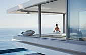 Serene woman meditating on patio