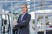 Portrait confident, car saleswoman standing